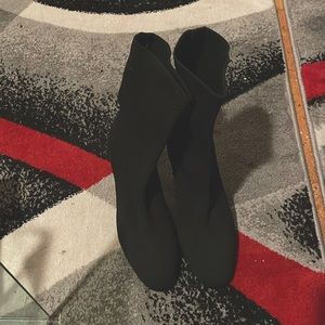 Black knit boot with 3 inch heel.